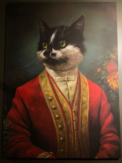 Cuadro gato blanco y negro traje rojo