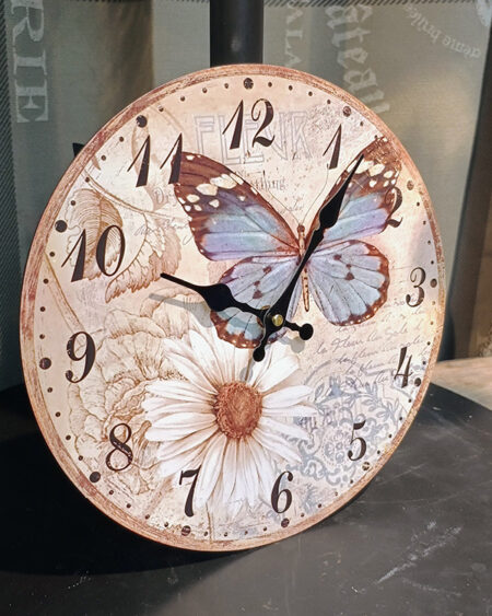Reloj tonos dorados mariposa